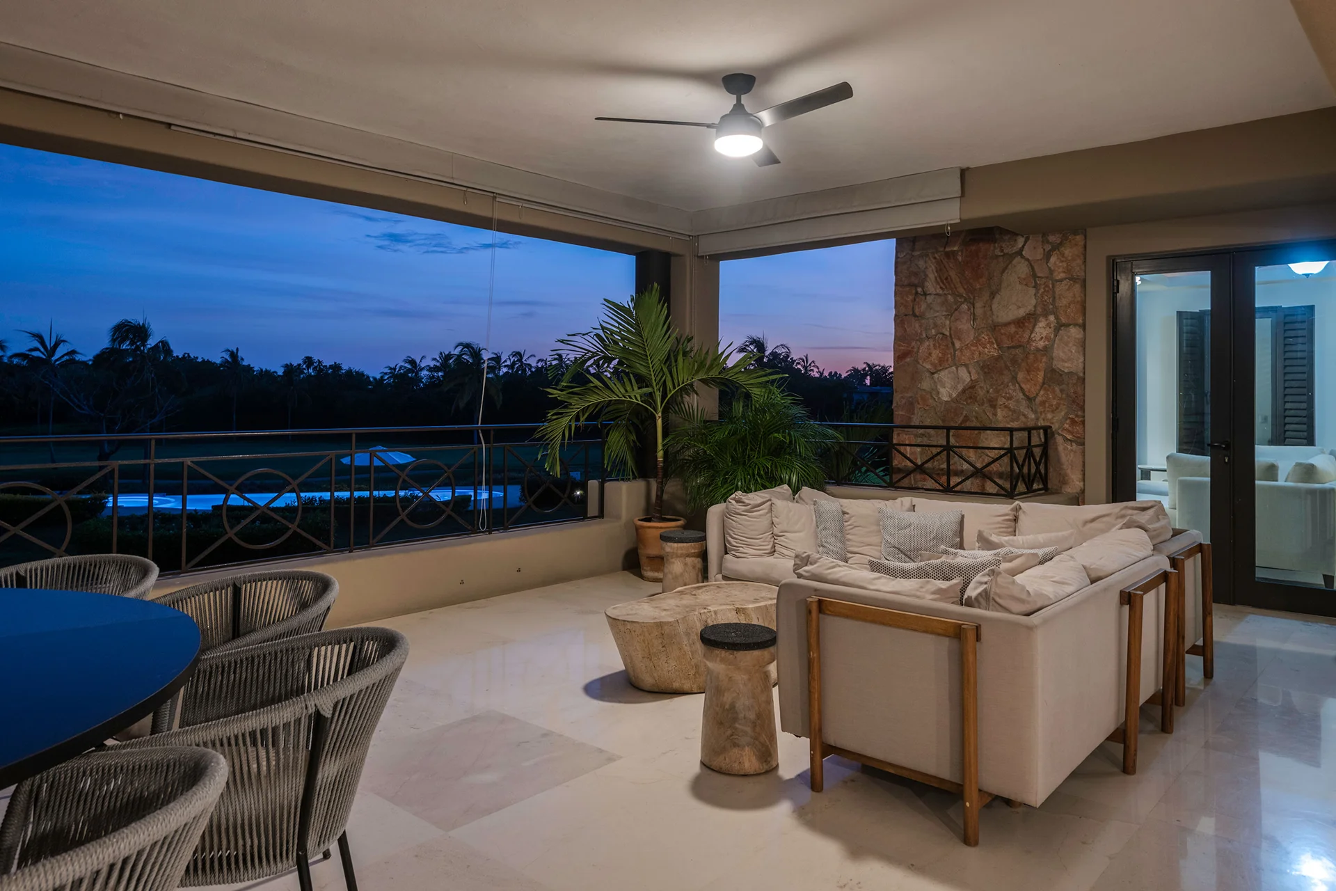 Condo Hacienda Los Amigos terrace lounge and dining at dusk above the golf course — Hacienda de Mita, Punta Mita
