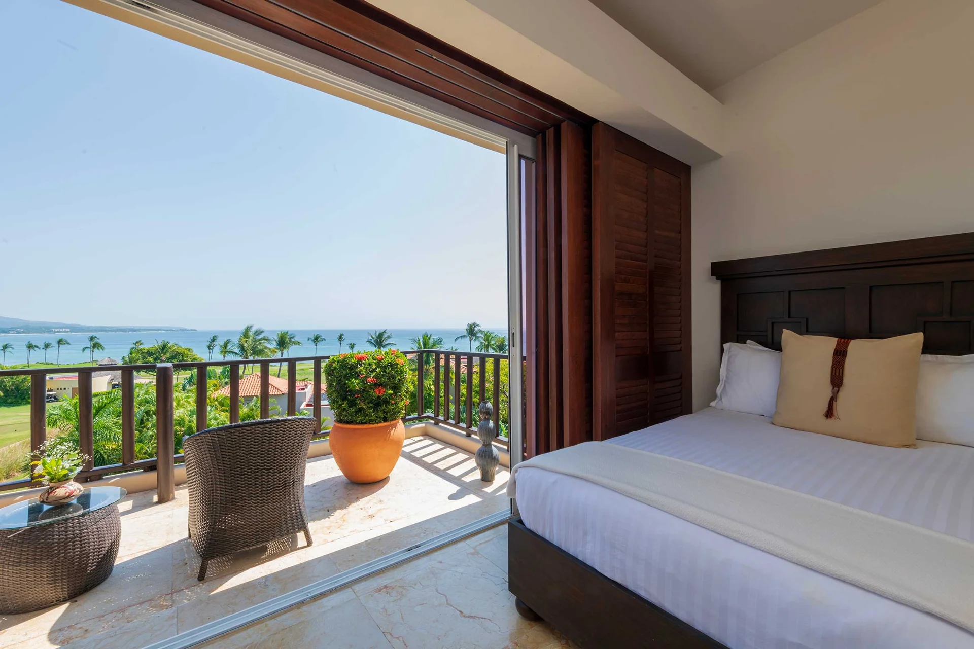 PH Vista Encanto king bed open to the terrace with ocean view — El Encanto, Punta Mita