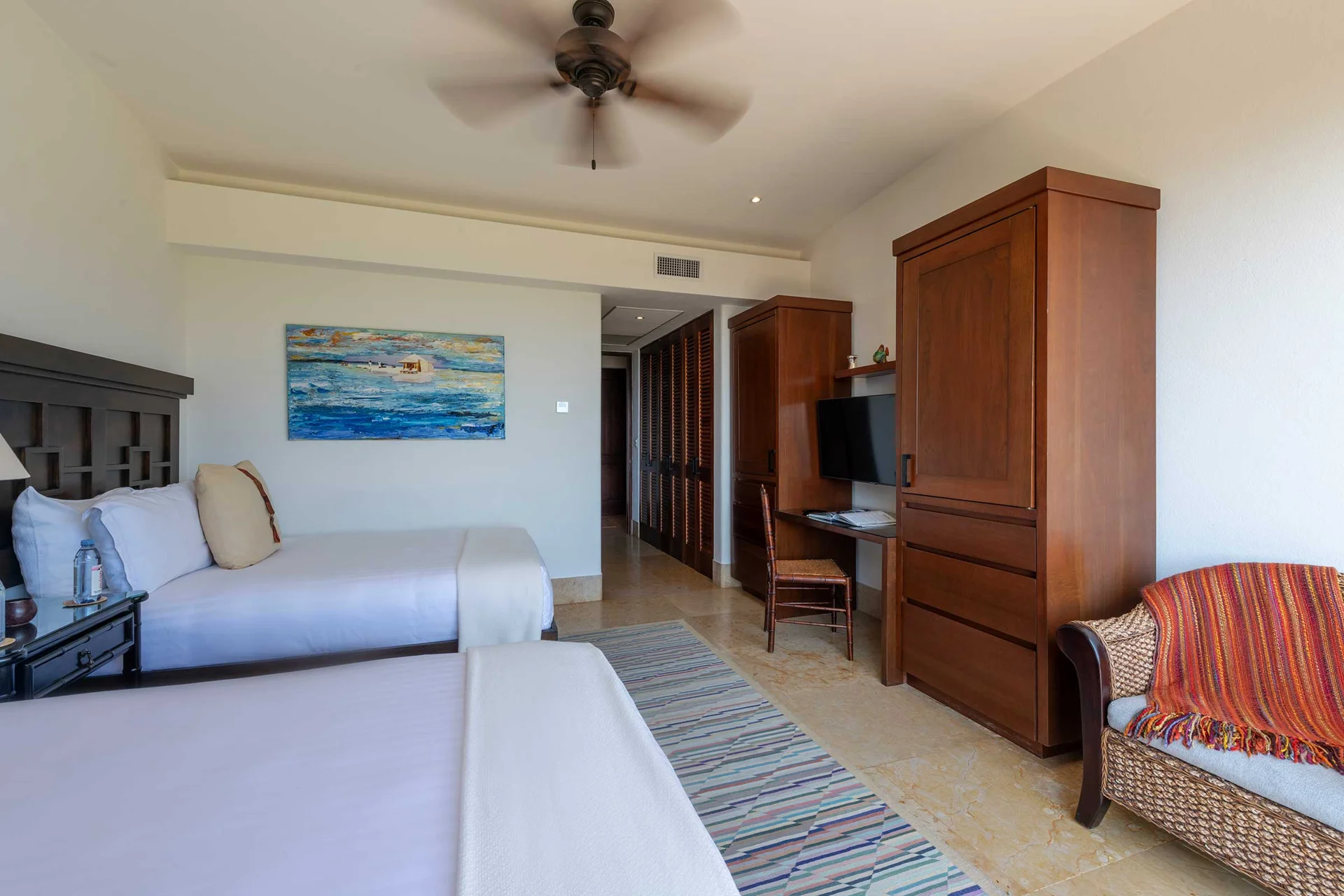 PH Vista Encanto guest bedroom with two queen beds and television — El Encanto, Punta Mita