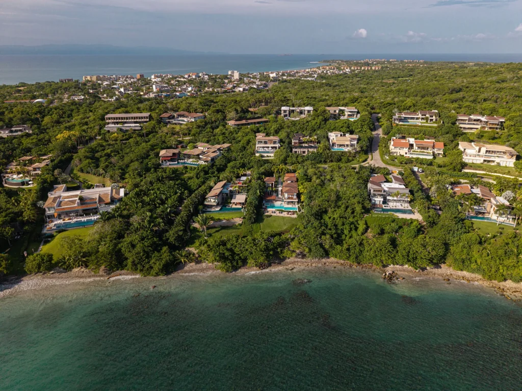 The green Punta Mita peninsula and its beaches from the air, two bays meeting at the point