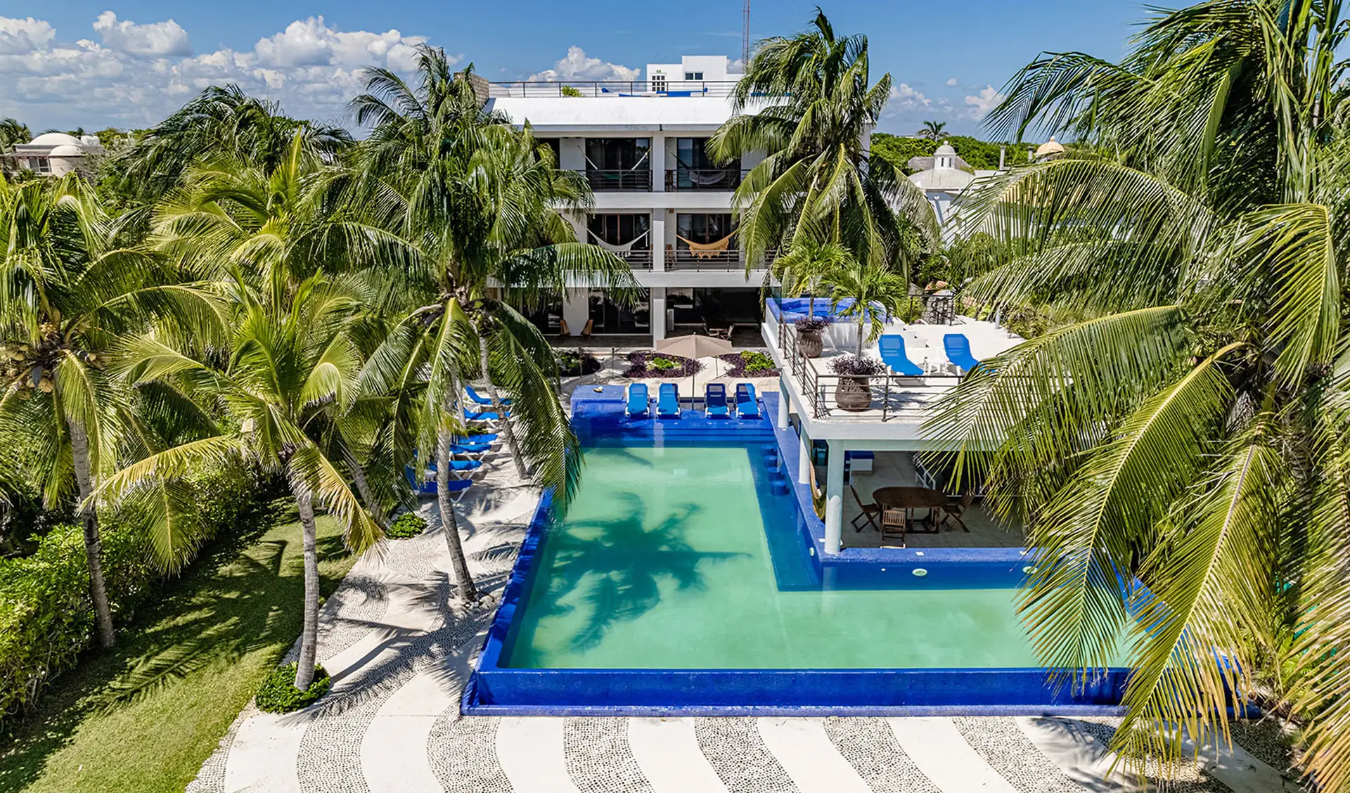 Villa Bellamar aerial view of pool, rooftop terrace and tropical grounds — Half Moon Bay, Akumal, Mexico