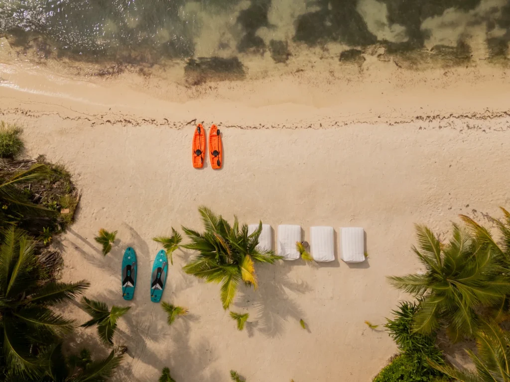 Kayaks and paddleboards on the sand in front of the residences, Isla Mujeres