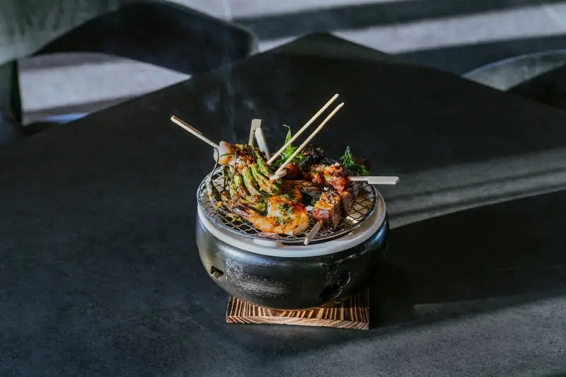 Skewers on a small robata grill at Aramara, Four Seasons Punta Mita
