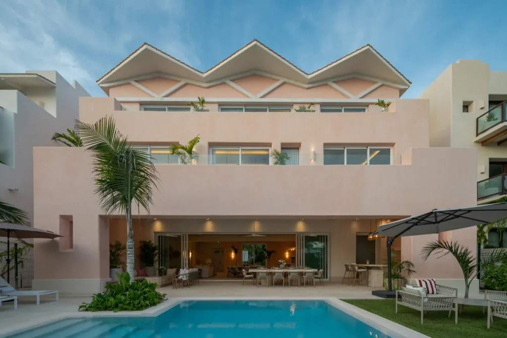 Casa Coral on Isla Mujeres: the pink three-storey house behind its pool