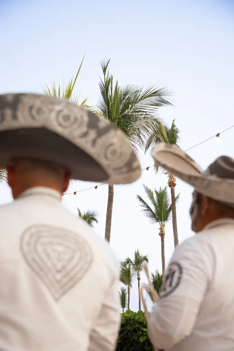 Two mariachis in white charro suits and sombreros on a Tertulia night at Dos Catrinas, Four Seasons Punta Mita