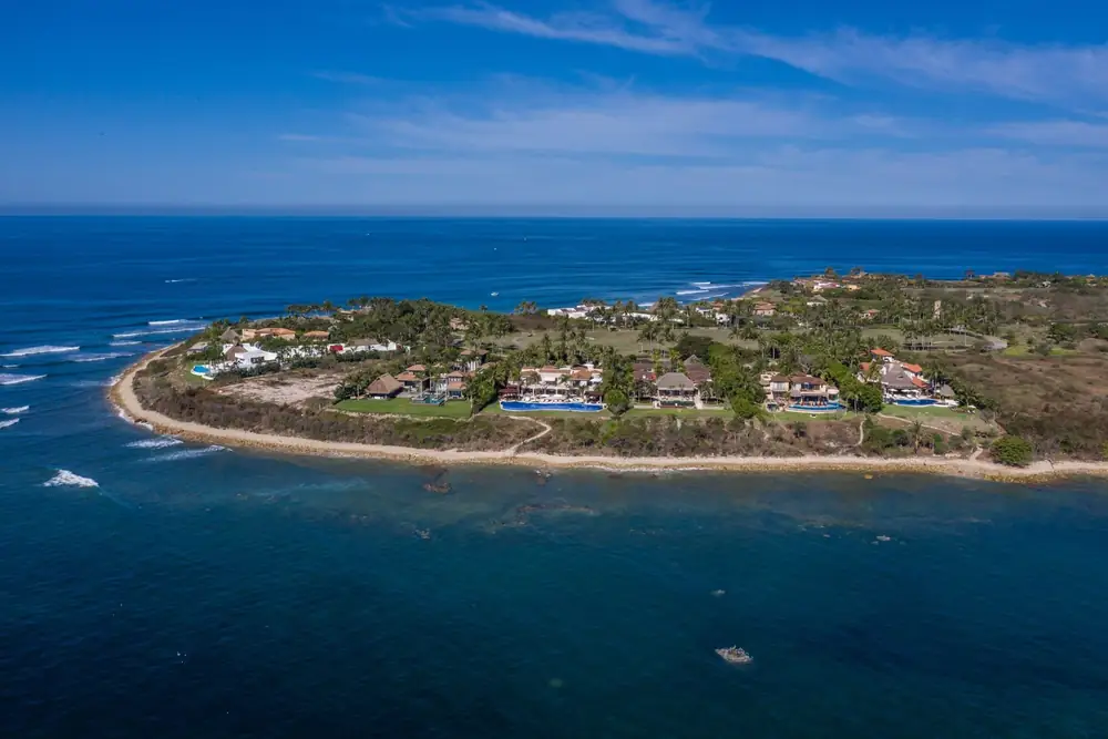 Aerial view of La Punta Estates at the tip of the Punta Mita peninsula, with Casa La Vida above the water