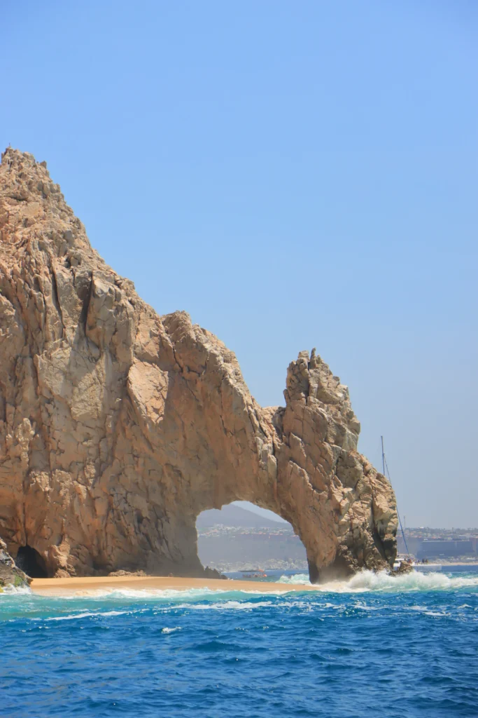 The Arch at Land’s End photographed from sea level in bright daylight.