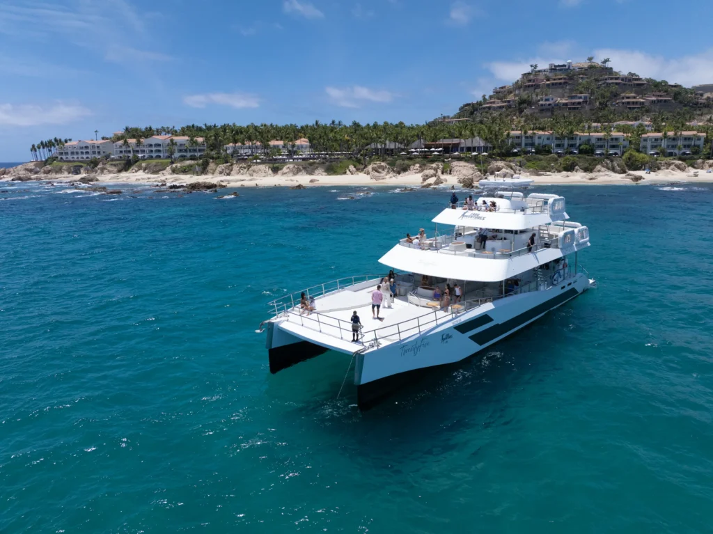 A catamaran runs along the dry coastline between Cabo San Lucas and San Jose.