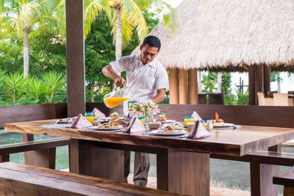 Service staff including a chef, maid, butler, and concierge at a private luxury villa.